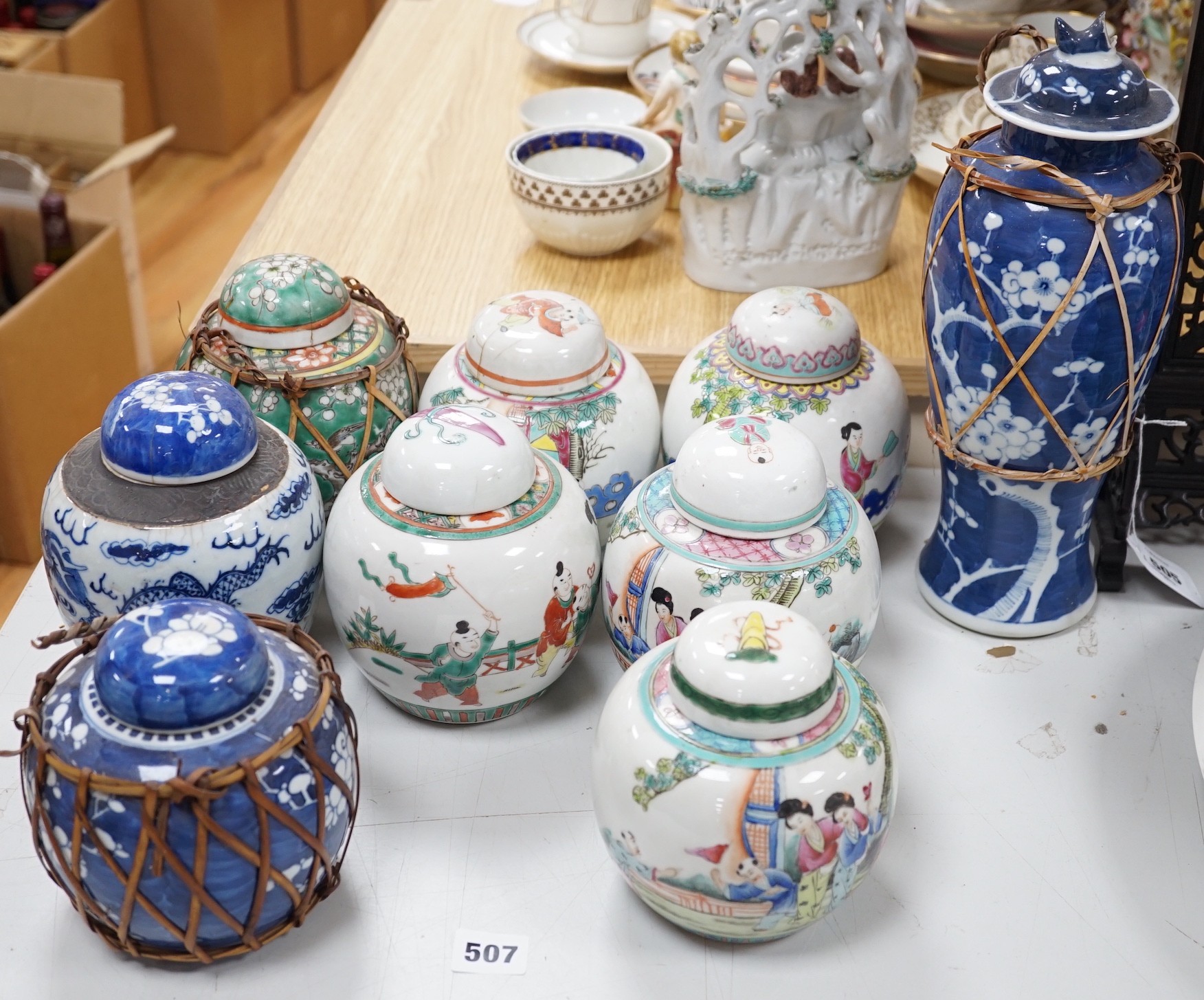 A collection of 19th and 20th century Chinese jars and covers and a blue and white vase and cover, vase 32cms high